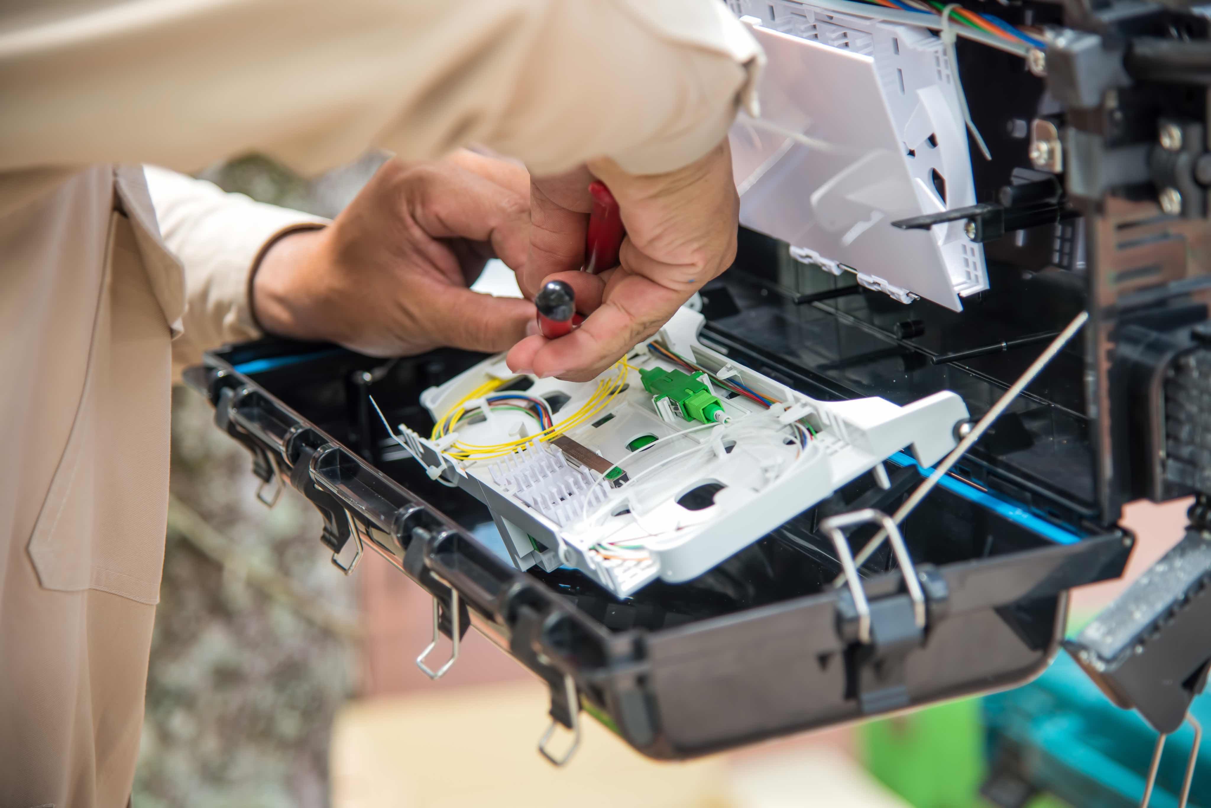 Professional printer repair technicians at work